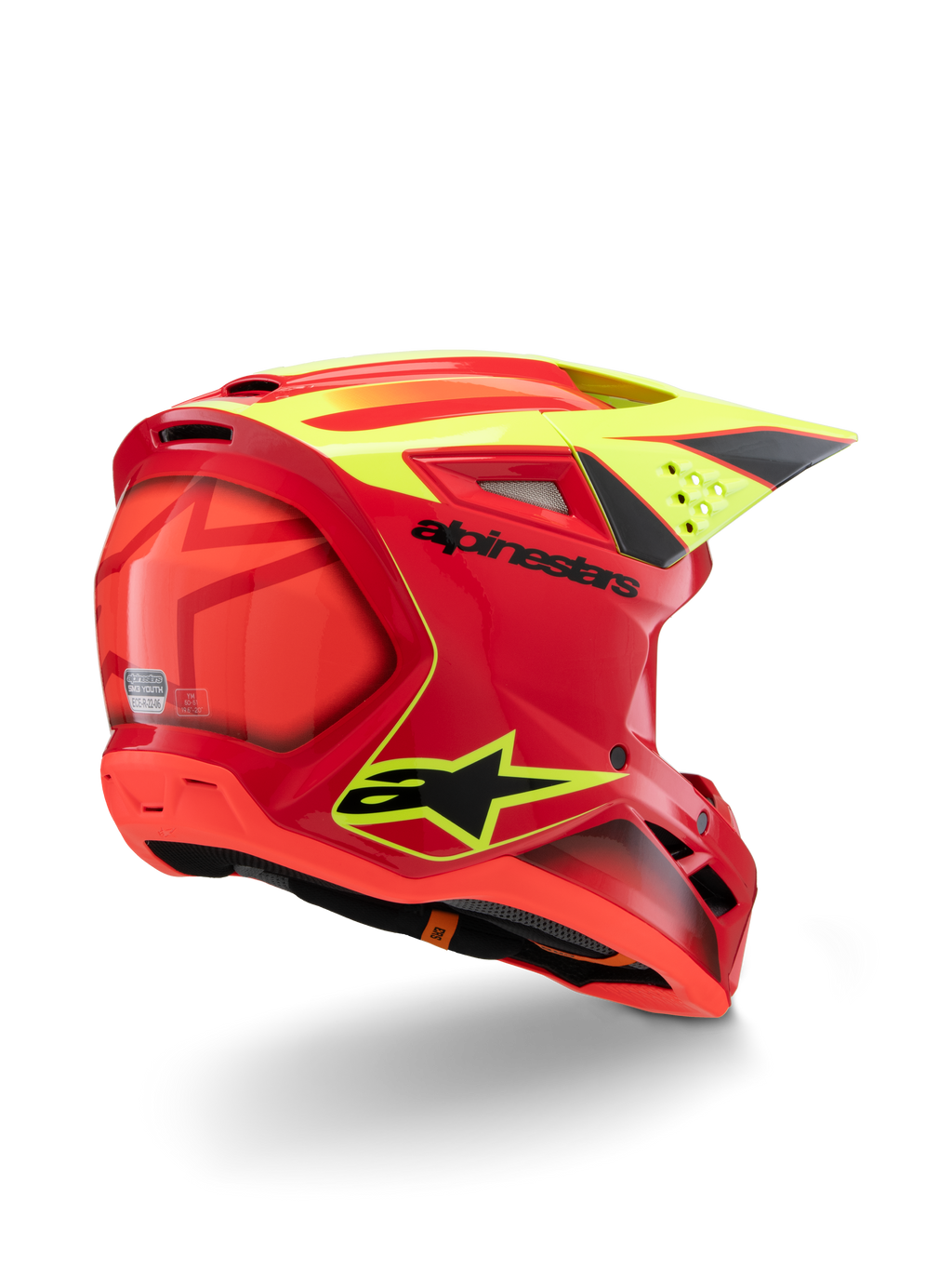 Alpinestars S-M3 Youth Fray-hjälm, röd och neongul blank finish, trekvartsvy bakifrån, med framträdande svarta logotyper och aerodynamiska ventiler, motocrosshjälm med hög synlighet för ungdomar