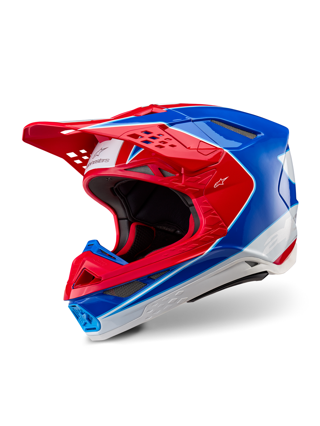 Alpinestars Supertech M10 Aeon-hjälm, motocrosshjälm, klar röd och blå med glansig yta, trekvartsvy som visar aerodynamiskt skal med flera ventilationsöppningar, vita och röda grafiska detaljer, Alpinestars-logotyp på skärmen och sidan, professionell racingutrustning för terrängkörning