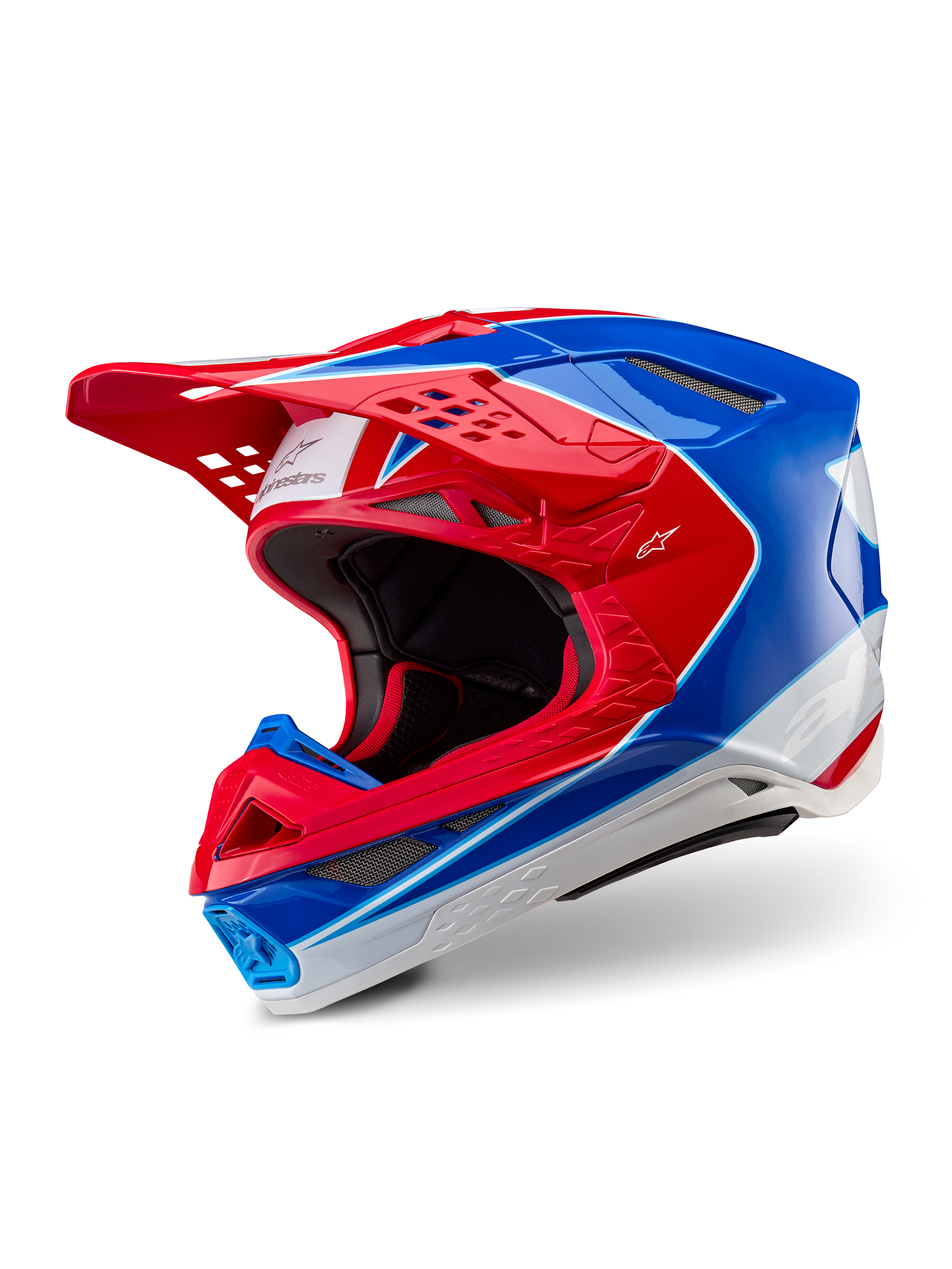 Alpinestars Supertech M10 Aeon-hjälm, motocrosshjälm, klar röd och blå med glansig yta, trekvartsvy som visar aerodynamiskt skal med flera ventilationsöppningar, vita och röda grafiska detaljer, Alpinestars-logotyp på skärmen och sidan, professionell racingutrustning för terrängkörning