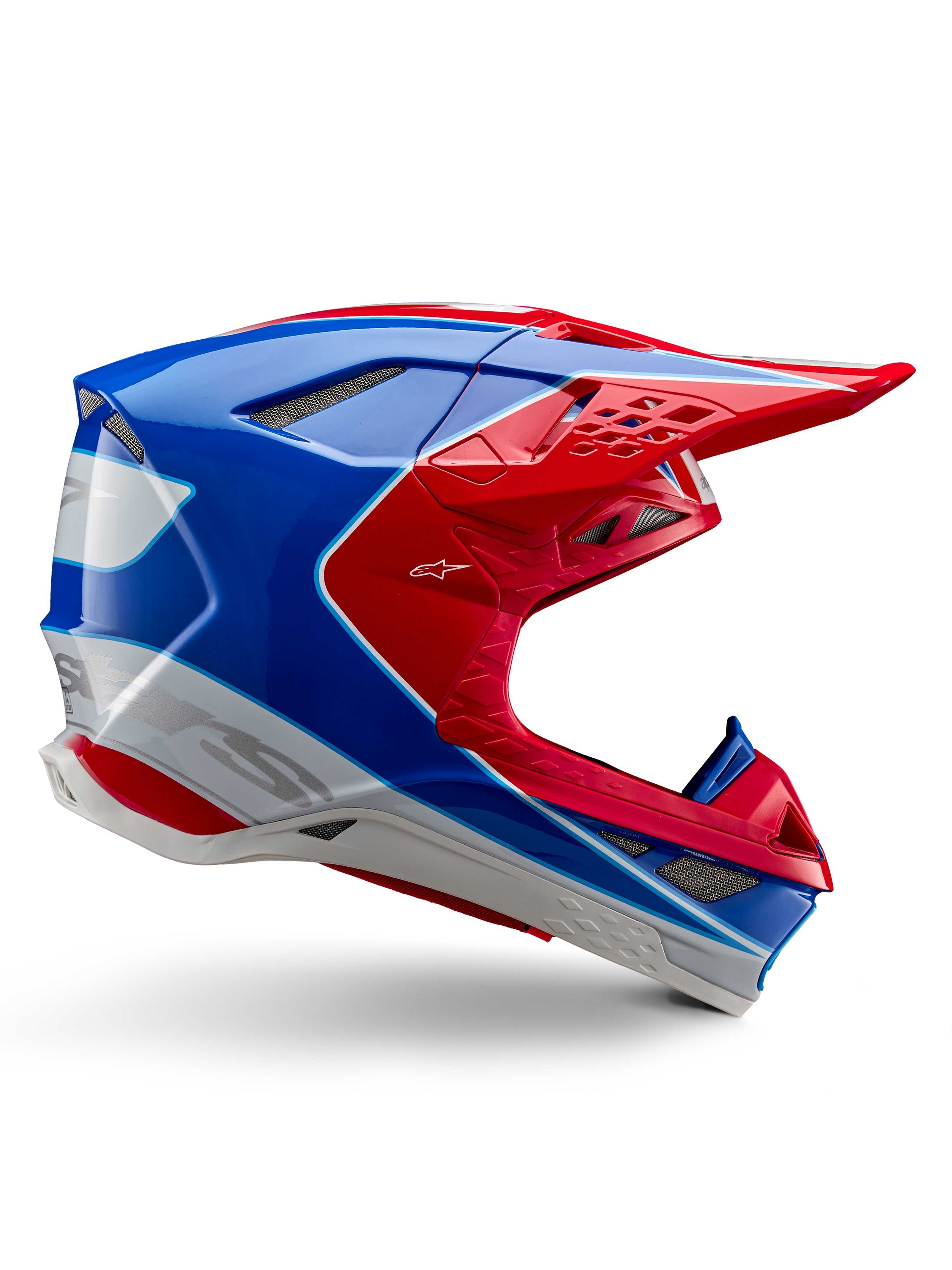 Alpinestars Supertech M10 Aeon hjälm, motocrosshjälm, klar röd, blå och vit, glansig finish, aerodynamisk sidoprofil med flera nät-täckta ventilationsöppningar, kantiga konturer och skärm