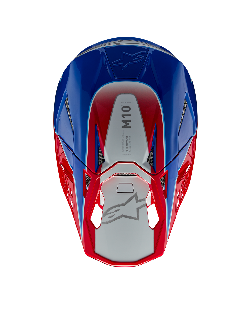 Alpinestars Supertech M10 Aeon hjälm, motocrosshjälm, klarröd och blå glansig, vy uppifrån som visar silverfärgad mittpanel med M10-logotyp, aerodynamiskt skal med röda och blå accenter, ventilationsportar i nät, högpresterande huvudskydd för motocross