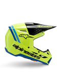 Alpinestars S-M3 Youth Radium-hjälm, motocrosshjälm för ungdomar, klar fluorgul med svarta och blå detaljer, sidovy som visar aerodynamisk design, svart skärm med gul logotyp, framträdande svart logotyp på sidan, ECE 22.06-certifierat skydd för terrängkörning