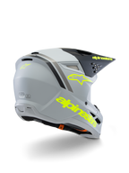 Alpinestars S-M3 Youth Radium Helmet ECE 22.06, motocrosshjälm, grå, svart och fluorescerande gul matt, vy trekvarts bakifrån som visar tydlig gul logotyp och stjärnsymbol, strömlinjeformat aerodynamiskt skal med ventilation för terrängkörning
