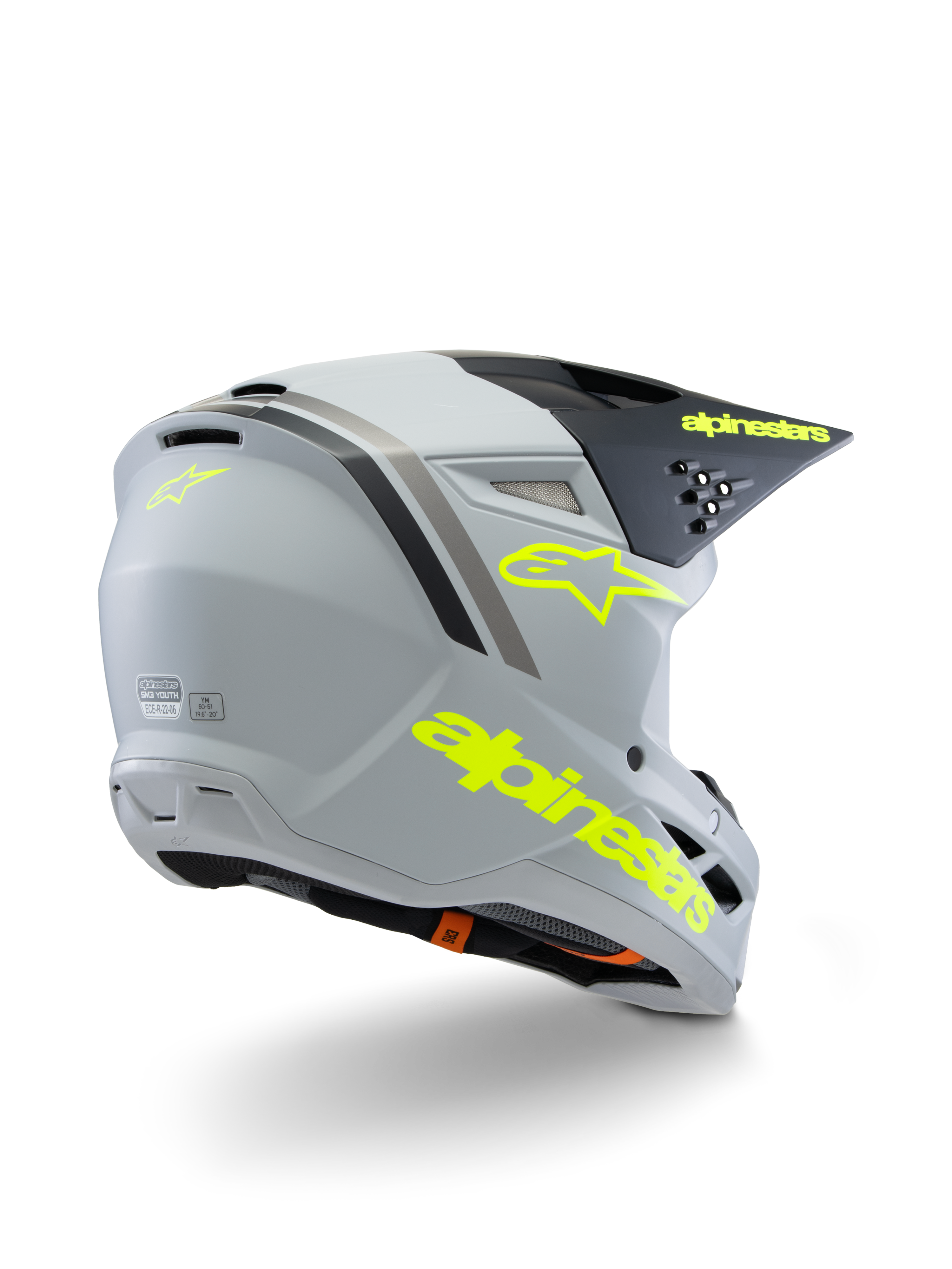 Alpinestars S-M3 Youth Radium Helmet ECE 22.06, motocrosshjälm, grå, svart och fluorescerande gul matt, vy trekvarts bakifrån som visar tydlig gul logotyp och stjärnsymbol, strömlinjeformat aerodynamiskt skal med ventilation för terrängkörning