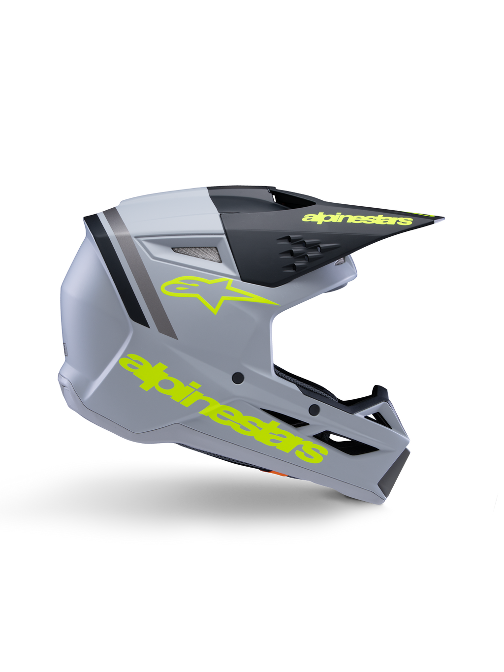 Alpinestars S-M3 Youth Radium-hjälm ECE 22.06, motocrosshjälm för ungdom, mattgrå och svart med neongul branding, sidoprofil som visar Alpinestars logotyp och text, aerodynamisk design med integrerad ventilation och svart visir.