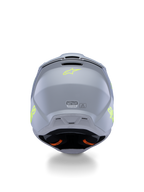 Alpinestars S-M3 Radium-hjälm för ungdomar ECE 22.06, grå, svart och neongul matt, vy bakifrån som visar ventilationsöppningar och certifieringsetiketter, neongul stjärnlogotyp, aerodynamisk skaldesign för motocross och terrängkörning