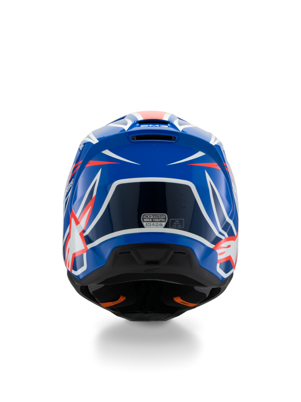 Alpinestars S-M3 Ungdom Wurx-hjälm ECE 22.06, motocrosshjälm, blå, röd och vit, vy bakifrån som visar aerodynamisk design med ventilationsöppningar, glansig finish med skarpa grafiska detaljer och säkerhetscertifieringsdekal.