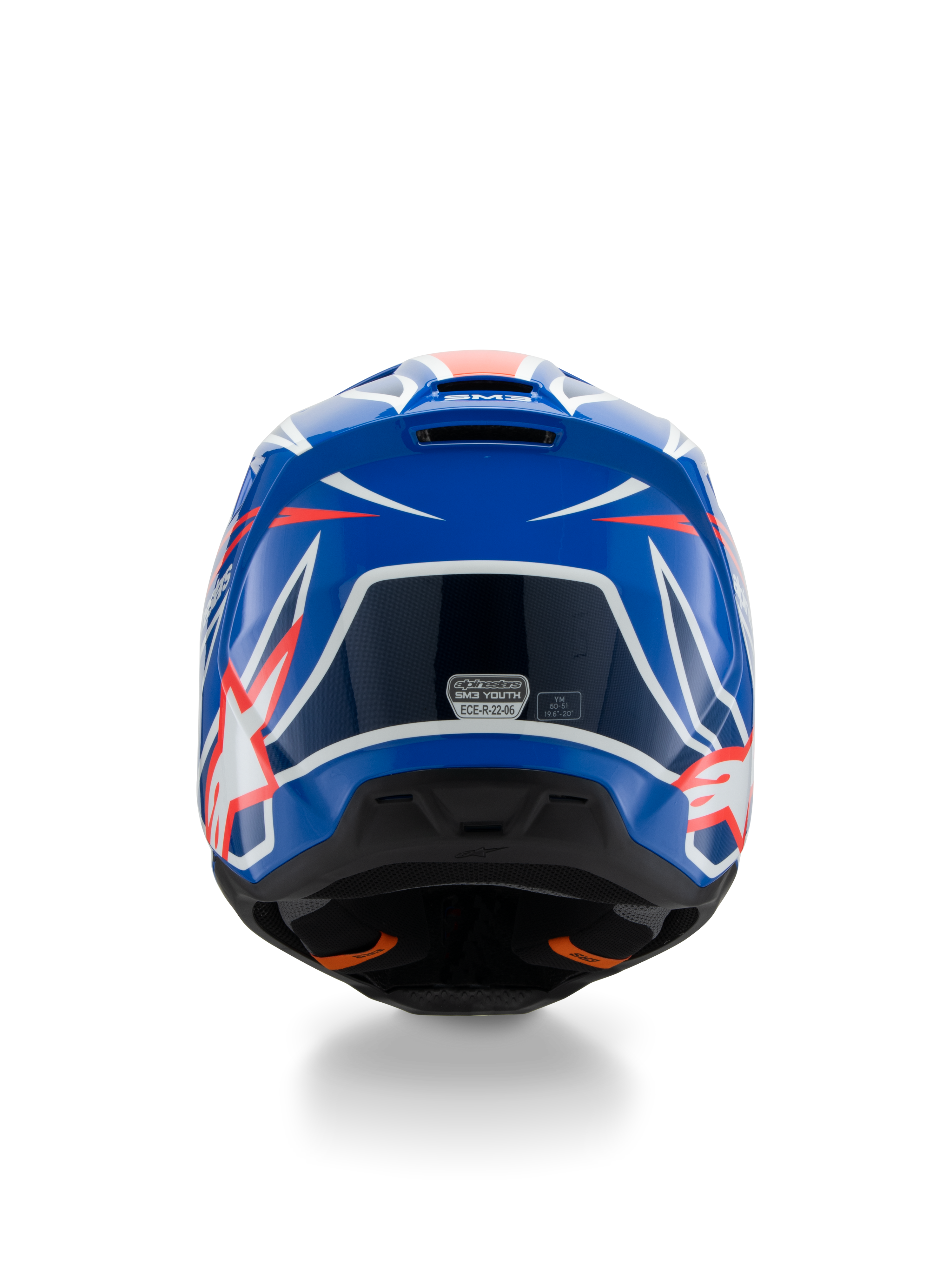 Alpinestars S-M3 Ungdom Wurx-hjälm ECE 22.06, motocrosshjälm, blå, röd och vit, vy bakifrån som visar aerodynamisk design med ventilationsöppningar, glansig finish med skarpa grafiska detaljer och säkerhetscertifieringsdekal.