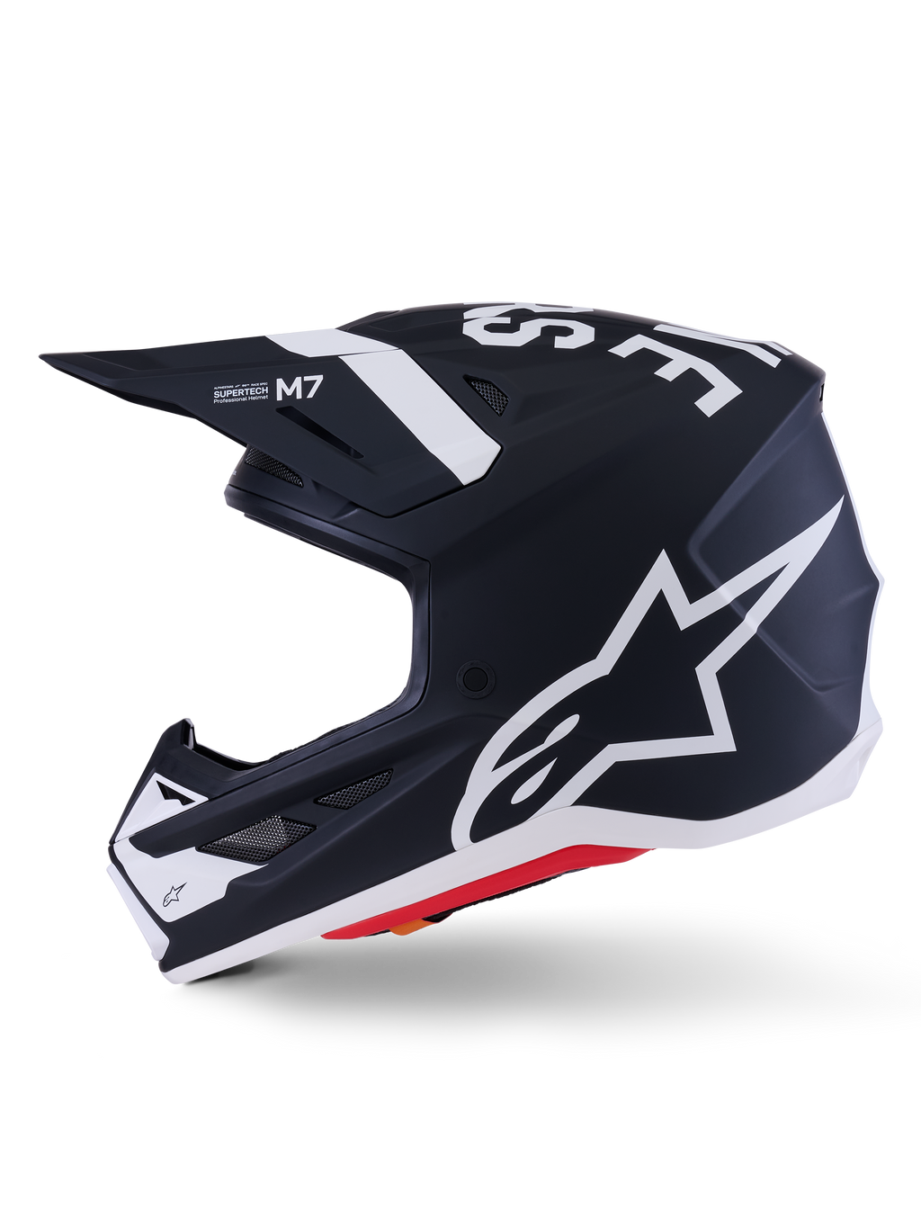 Alpinestars S-M7 Dasher hjälm ECE 22.06, matt svart och vit, sidoprofil med stor vit Alpinestars-logotyp, aerodynamiskt kompositskal med ventilationsportar och röd detalj längs nederkanten, professionellt huvudskydd för motocross