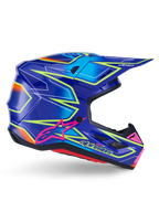 Alpinestars S-M7 Cast Helmet, motocrosshjälm, blå, rosa och neongul glansig finish, sidoprofil med framträdande geometriska mönster, rosa Alpinestars-logotyp och ventilerat aerodynamiskt skal.