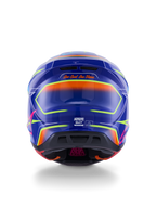 Alpinestars S-M7 Cast-hjälm ECE 22.06, motocrosshjälm, blå, rosa och neongul blank finish, vy bakifrån som visar sloganen 'One Goal. One Vision.', aerodynamiskt kompositskal med integrerade ventilationsportar och livfulla neonaccenter