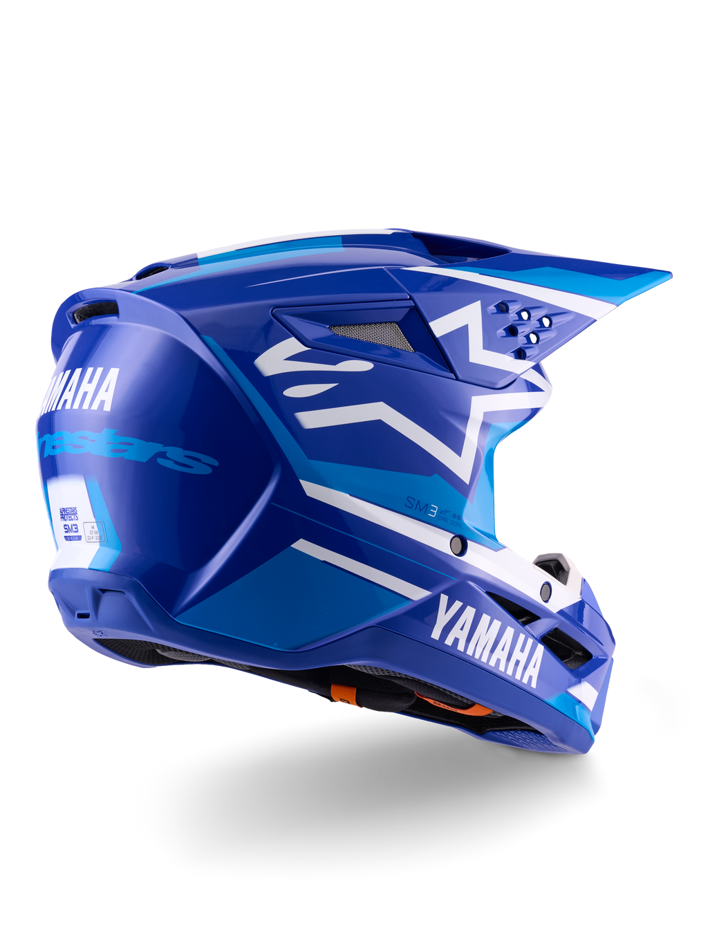 Alpinestars Yamaha S-M3-hjälm ECE 22.06, motocrosshjälm, blå och vit glansig, med Yamaha- och Alpinestars-logotyper, vit stjärnlogotyp på sidan, flera luftintag och utloppsventiler, aerodynamisk design för terrängprestanda