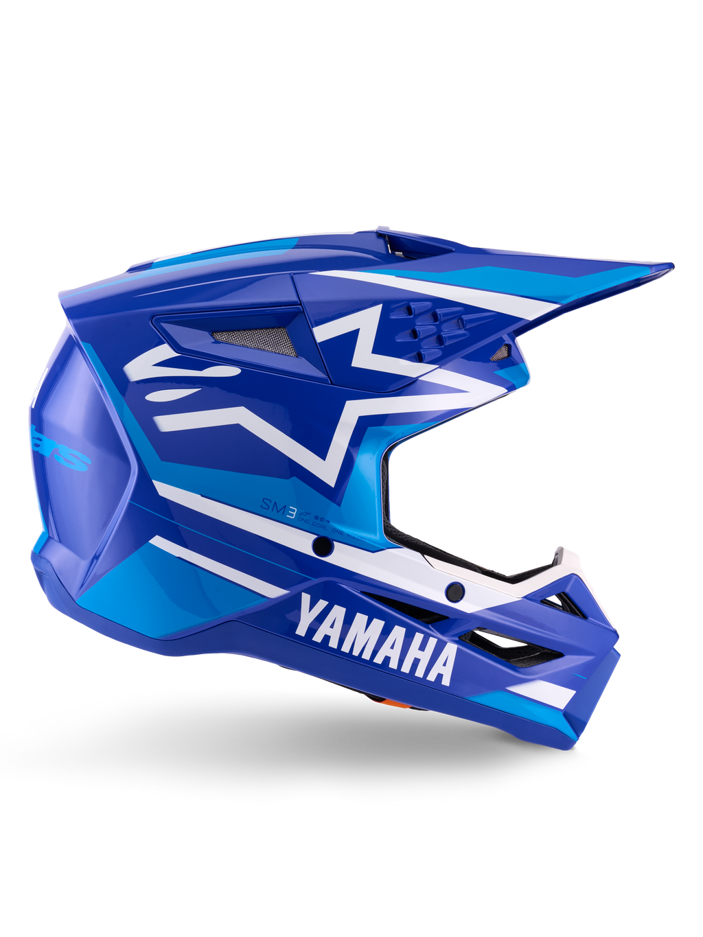 Alpinestars Yamaha S-M3-hjälm ECE 22.06, motocrosshjälm, blå och vit glansig finish, med tydlig Yamaha-logotyp och geometriska mönster, aerodynamisk design med svarta nätventiler och spetsig skärm, professionell terrängutrustning
