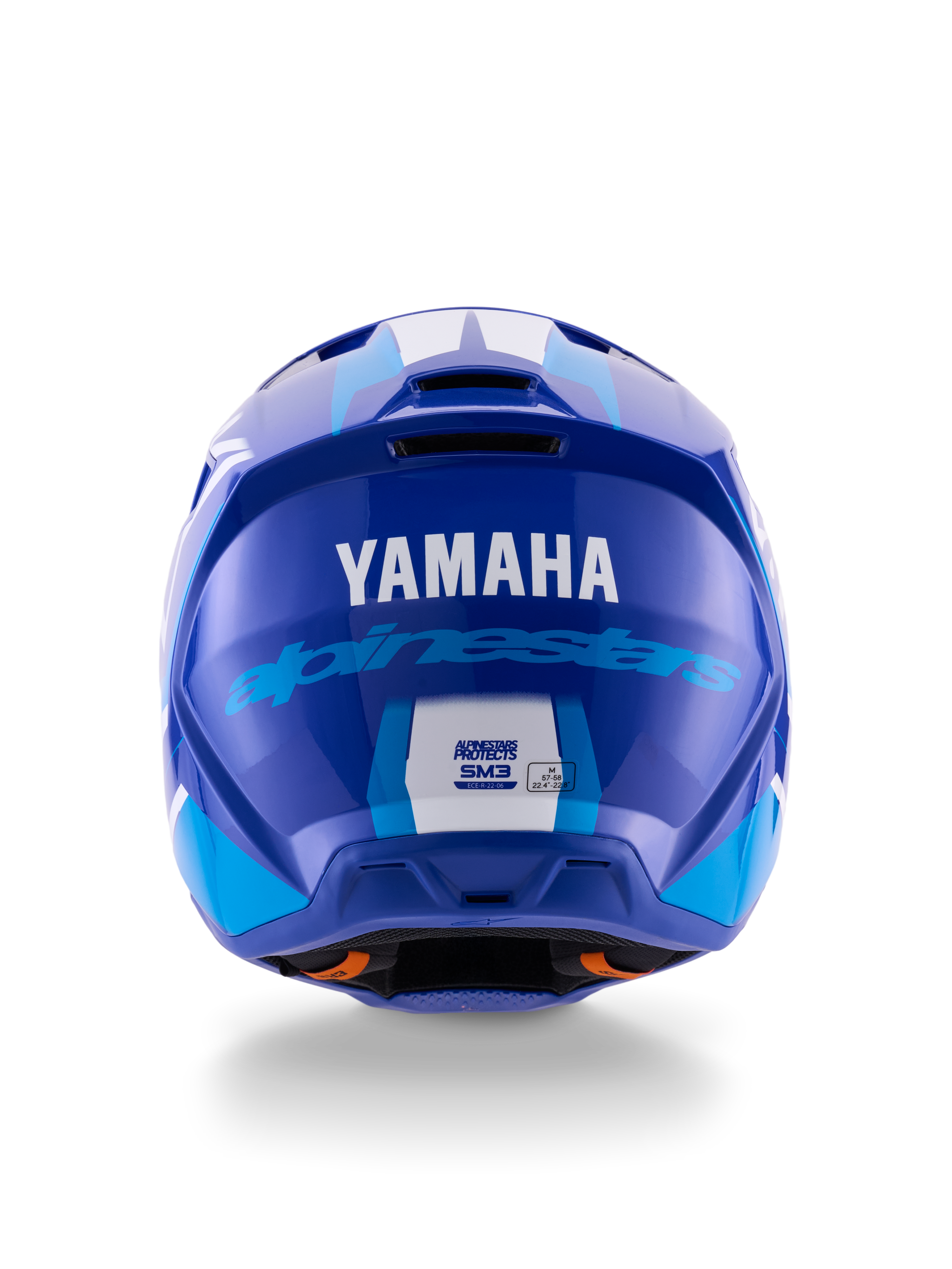 Alpinestars Yamaha S-M3-hjälm, motocrosshjälm, blå vit blank, vy bakifrån som visar vit YAMAHA-logotyp och blå Alpinestars-text, elegant blank yta med synliga ventilationsöppningar och säkerhetscertifieringsetiketter.