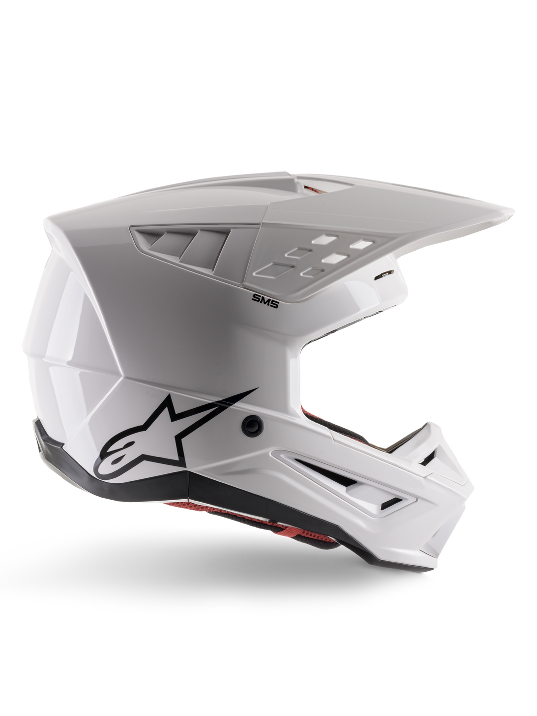 Alpinestars S-M5 Solid-hjälm ECE 22.06, motocrosshjälm, blank vit, sidoprofil med kantig aerodynamisk design, framträdande skärm, integrerade ventilationsöppningar, svart Astars-logotyp baktill och synlig röd innerstoppning