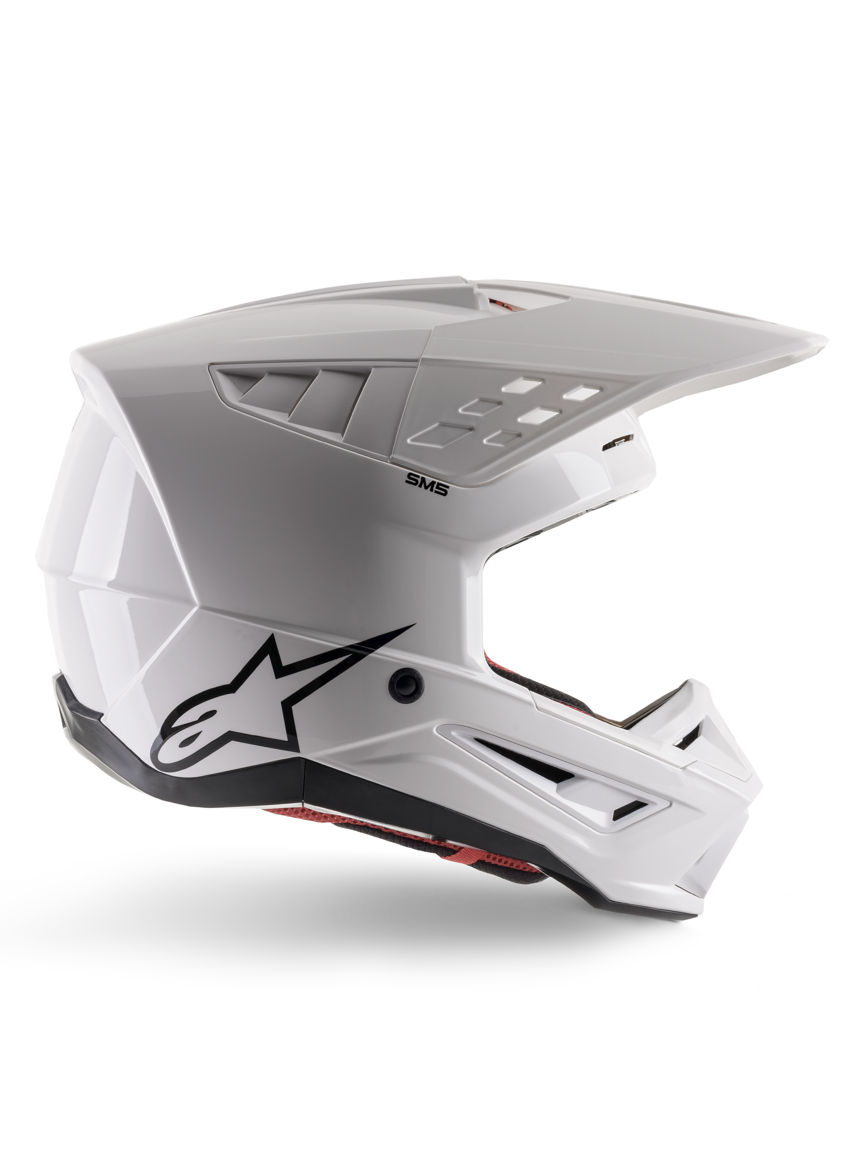 Alpinestars S-M5 Solid-hjälm ECE 22.06, motocrosshjälm, blank vit, sidoprofil med kantig aerodynamisk design, framträdande skärm, integrerade ventilationsöppningar, svart Astars-logotyp baktill och synlig röd innerstoppning