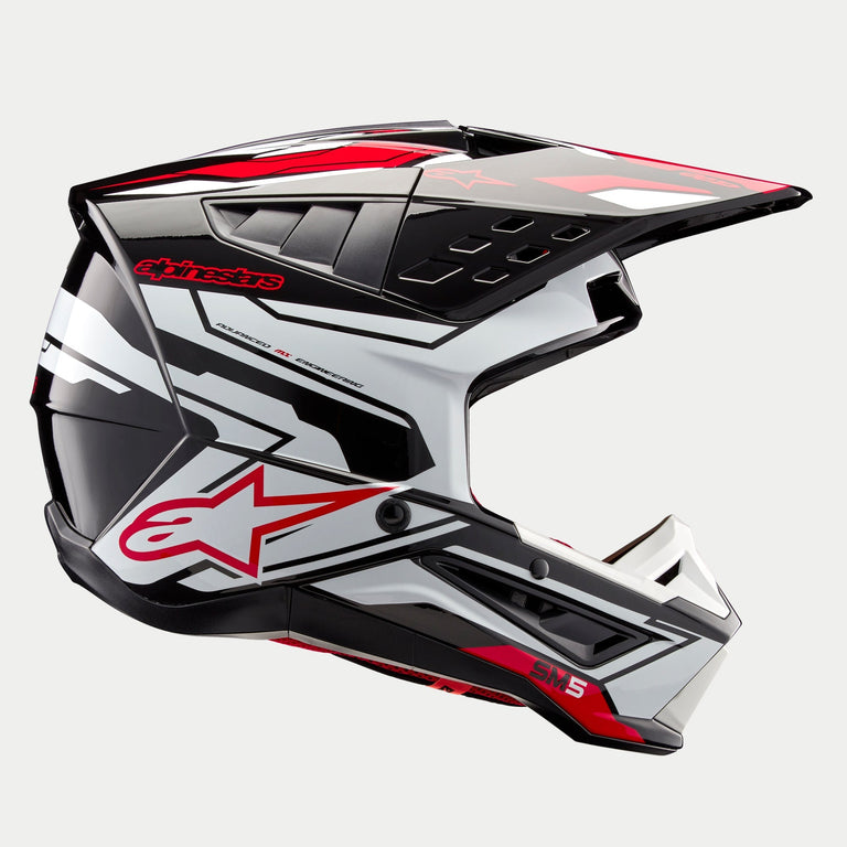Alpinestars S-M5 Action 2 Helmet ECE, Motocross Helmet, Black White Bright Red Glossy, side profile view showing bold graphics and red star logo, sleek aerodynamic shell with multiple air vents, adjustable visor, high-performance gear for off-road racing