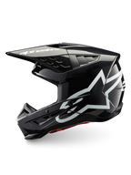 Alpinestars S-M5 Corp hjälm, mörkgrå glansig motocrosshjälm för terrängkörning, vita logotyper, ECE 22.06-certifierad.