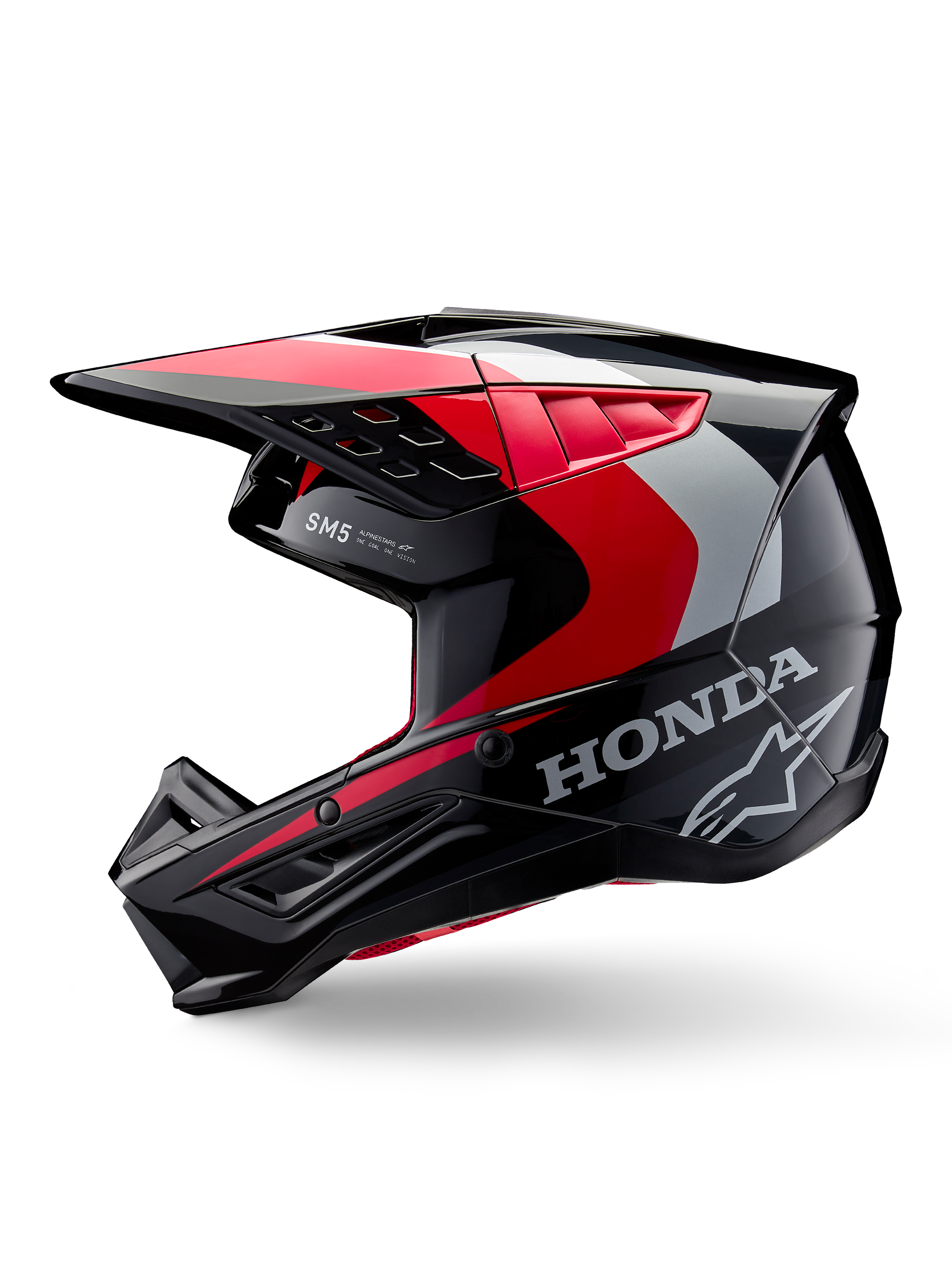 Alpinestars Honda S-M5-hjälm, motocrosshjälm, svart, röd och silver med glansig finish, profilvy med Honda-branding och Alpinestars stjärnlogotyp, strömlinjeformad design med integrerad skärm och ventilationsportar för terrängkörning