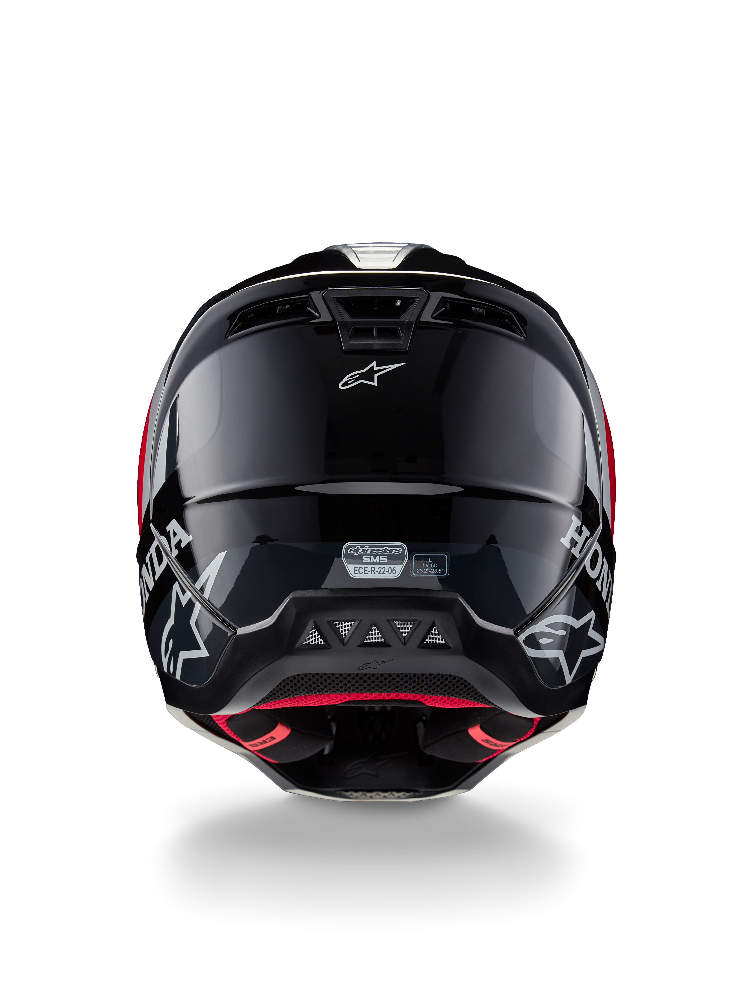 Alpinestars Honda S-M5 ECE-hjälm, motocrosshjälm, blank svart och röd, baksida som visar ett blankt svart skal med vita Honda- och Alpinestars-logotyper, rött innerfoder och ECE-säkerhetscertifieringsetikett