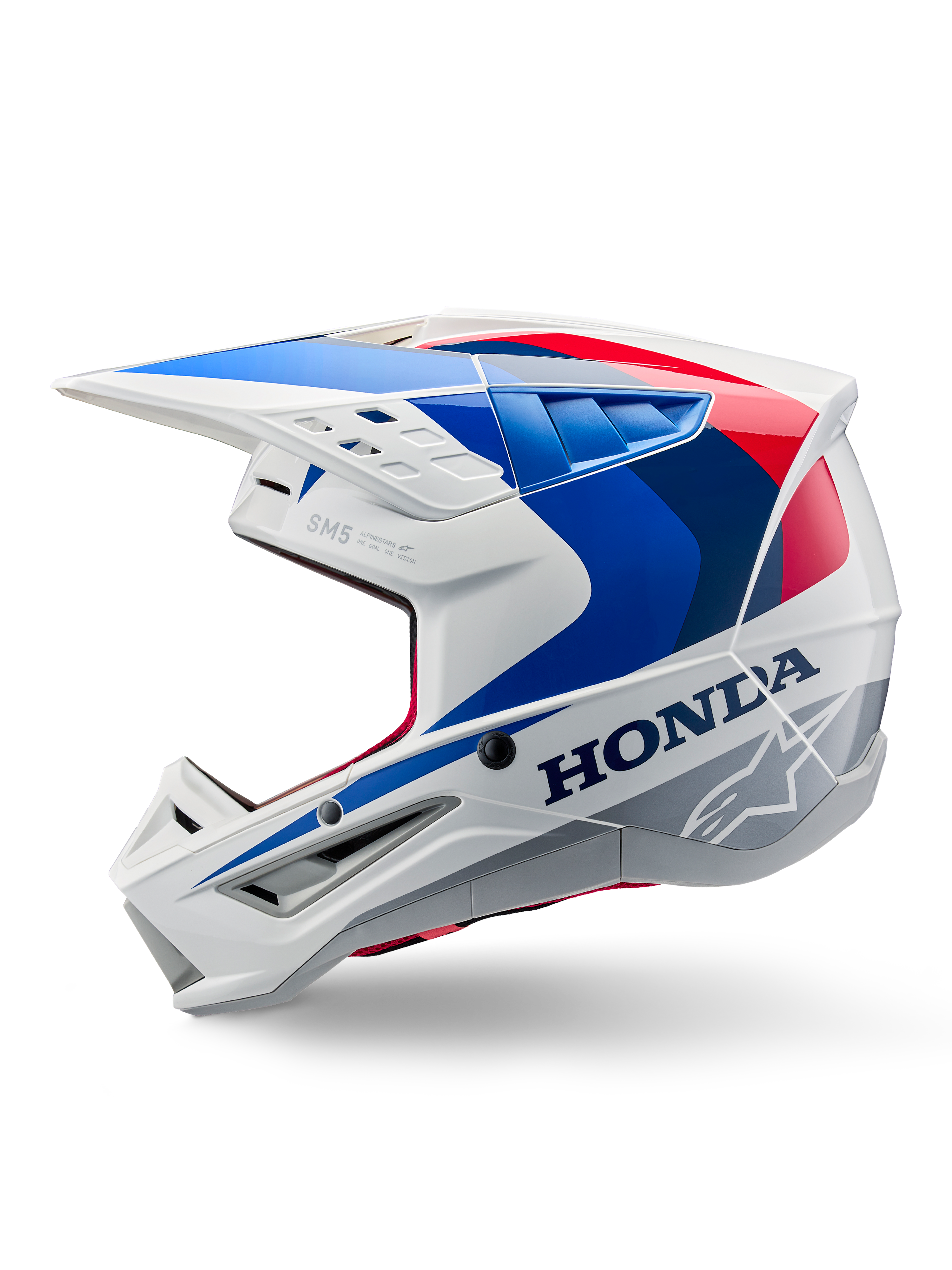 Alpinestars Honda S-M5 ECE-hjälm, vit, blå och röd med blank finish, sidoprofil, med tydlig Honda-logotyp och Alpinestars stjärnlogotyp, aerodynamisk motocrossdesign med flera luftventiler och en framträdande skärm, blank finish