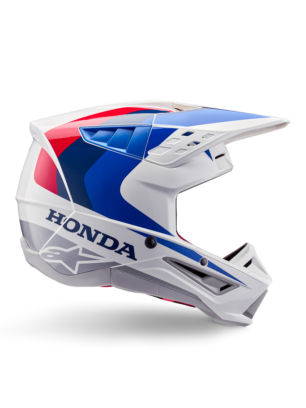 Alpinestars Honda S-M5-hjälm ECE, motocrosshjälm, vit, blå och röd, sidoprofil, aerodynamisk design med integrerat visir, flera ventilationsöppningar, glansig finish, tydlig Honda-logotyp och Alpinestars-logotyp