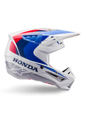 Alpinestars Honda S-M5-hjälm ECE, motocrosshjälm, vit, blå och röd, sidoprofil, aerodynamisk design med integrerat visir, flera ventilationsöppningar, glansig finish, tydlig Honda-logotyp och Alpinestars-logotyp