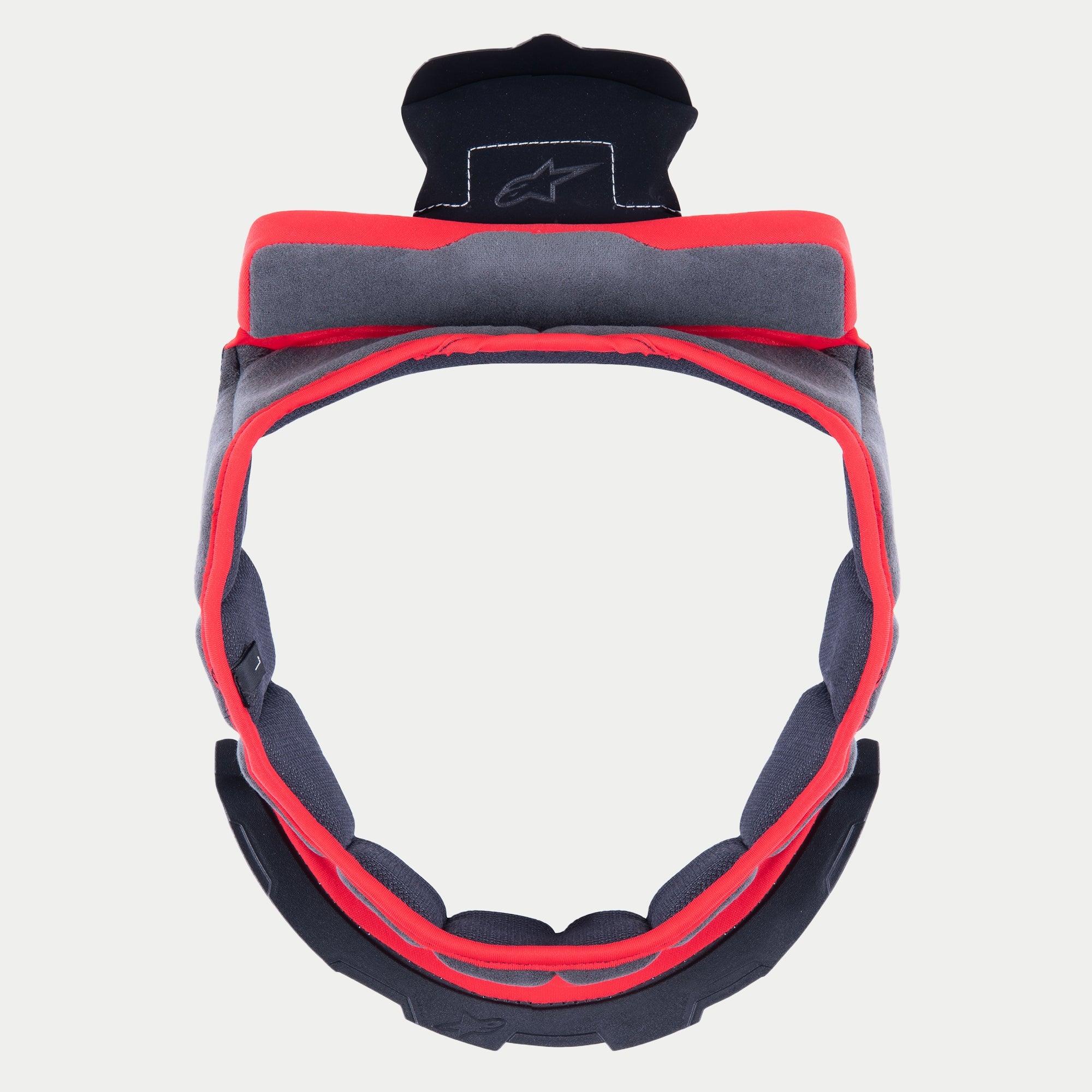 Alpinestars Supertech R10 kronkudde, ersättningsfoder för hjälm, grått mjukt tyg med röd kant och svarta fästflikar, cirkulär design för S-R10-hjälmar, med broderad stjärnlogotyp på den övre fliken.