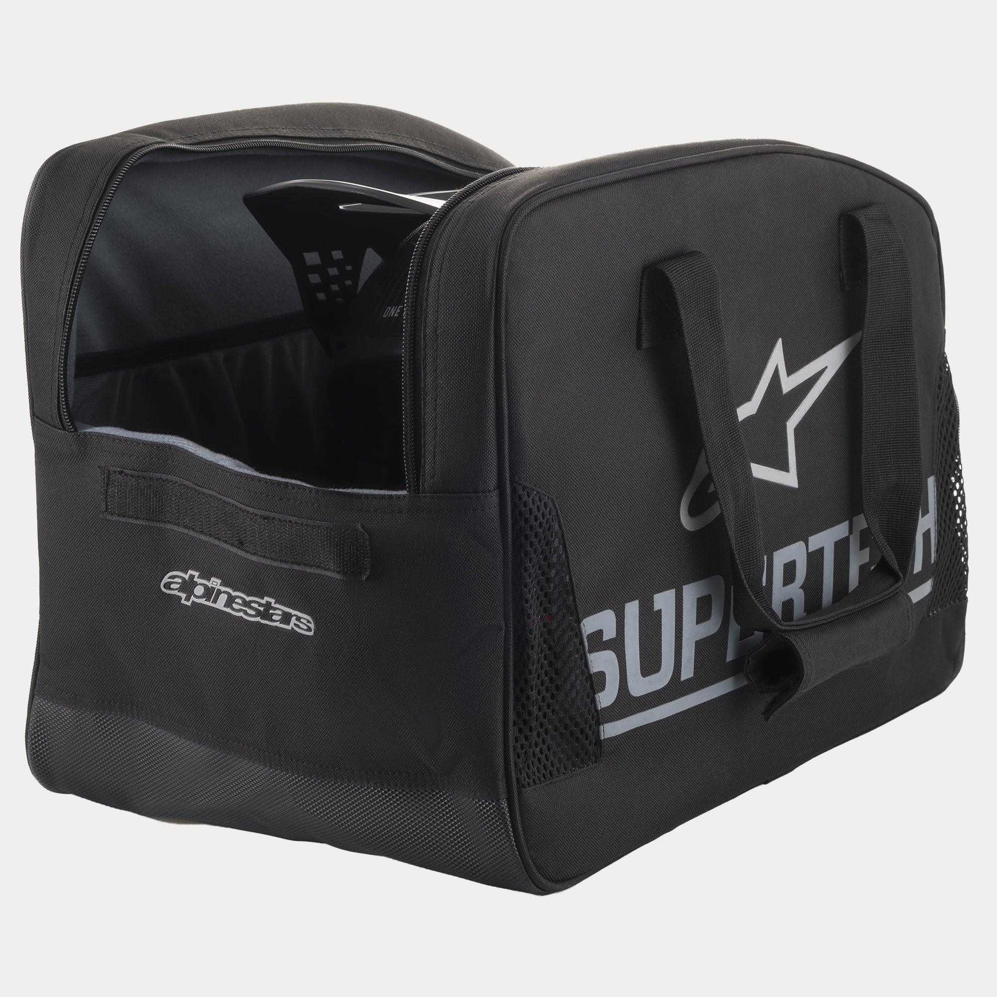 Alpinestars Supertech Semi Rigid Helmet Bag, Black motocross helmet bag featuring silver branding, durable web carrying handles, and a secure semi-rigid construction