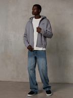 Alpinestars Essentials Ageless Zip Hoodie, Silver, casual streetwear, full-zip fleece hoodie with a small black logo on the chest, worn by a model with a white t-shirt and blue jeans, relaxed lifestyle fit