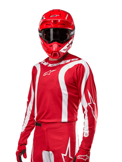 2024 Fluid Lurv Jersey, Motocross Racing Jersey, Mars Red and White, worn with matching red helmet and gloves, bold sporty design with white curved stripes and Alpinestars branding