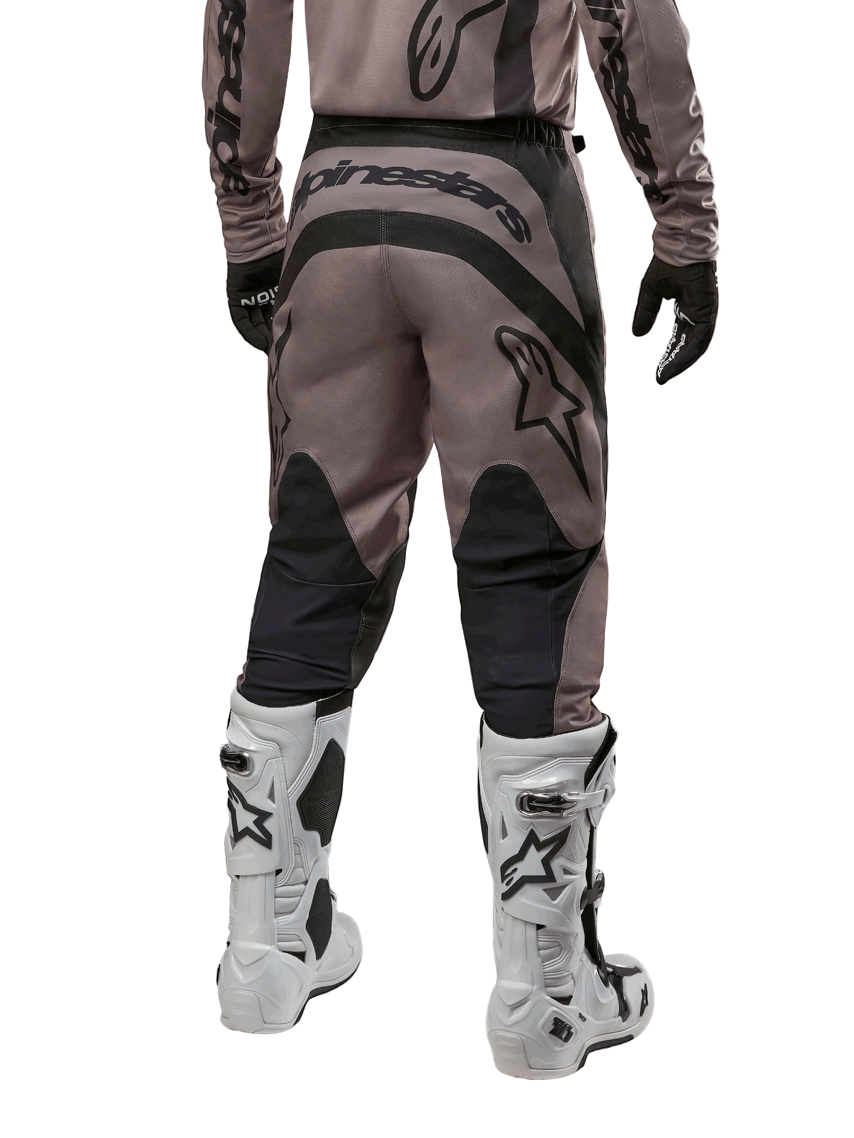 Alpinestars 2024 Fluid Lurv Pants, Motocross Pants, Mud Black, back view showing large black Alpinestars logo on the seat and black calf panels, worn with white and black motocross boots and matching jersey.
