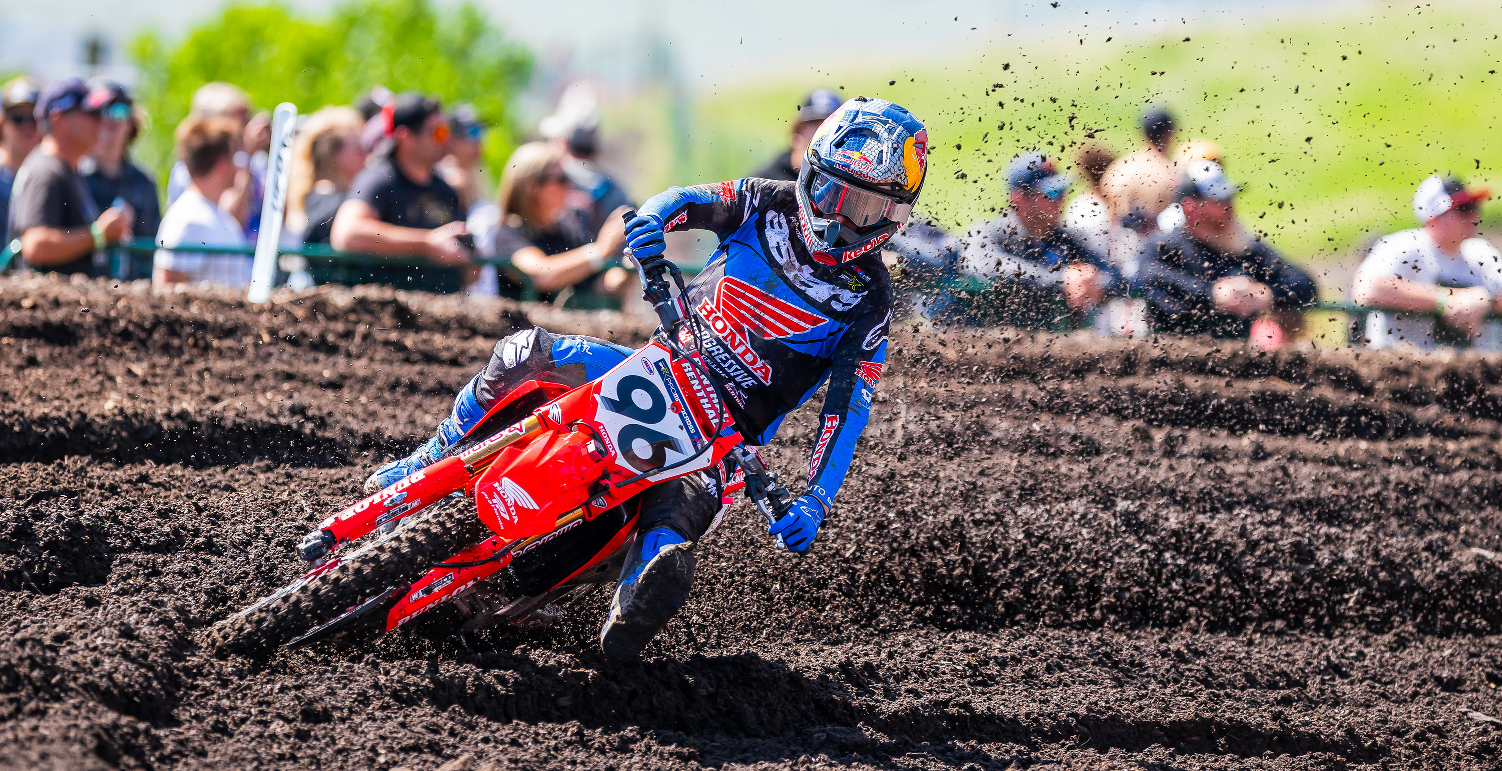Hunter Lawrence wearing Alpinestars mx gear in action on a dirt track with spectators in the background