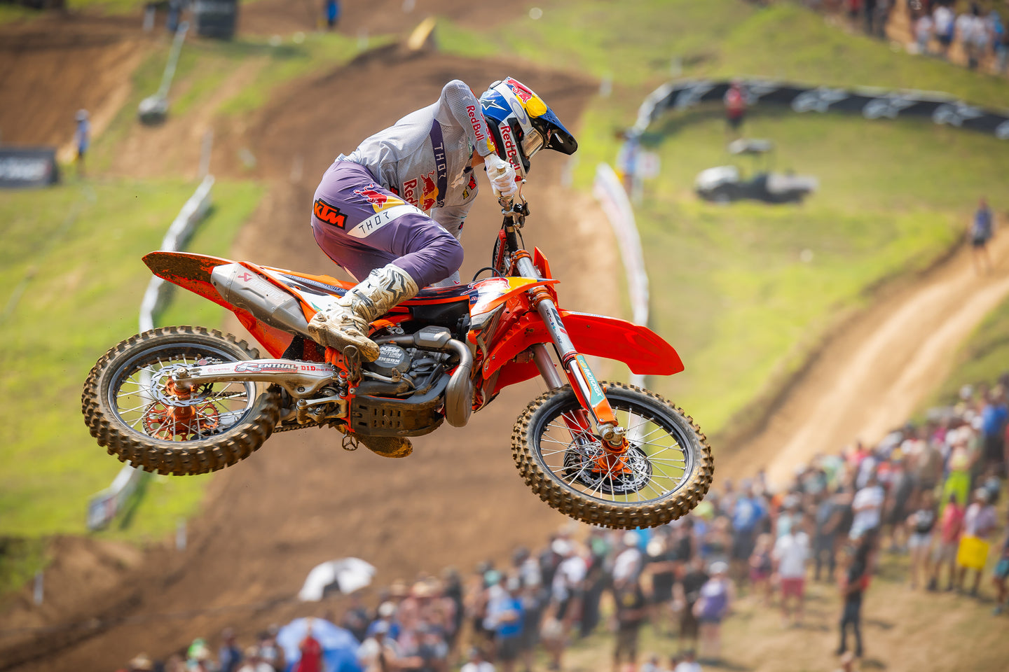 Aaron Plessinger performing a stunt on his mx bike while wearing Alpinestars clothing and protections