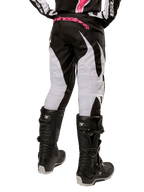Alpinestars Women Stella 2024 Fluid Pant, Motocross Pants, Black and White, back view showing white leg panels and pink branding on waistband, worn with black Tech 3 boots, durable gear for off-road racing