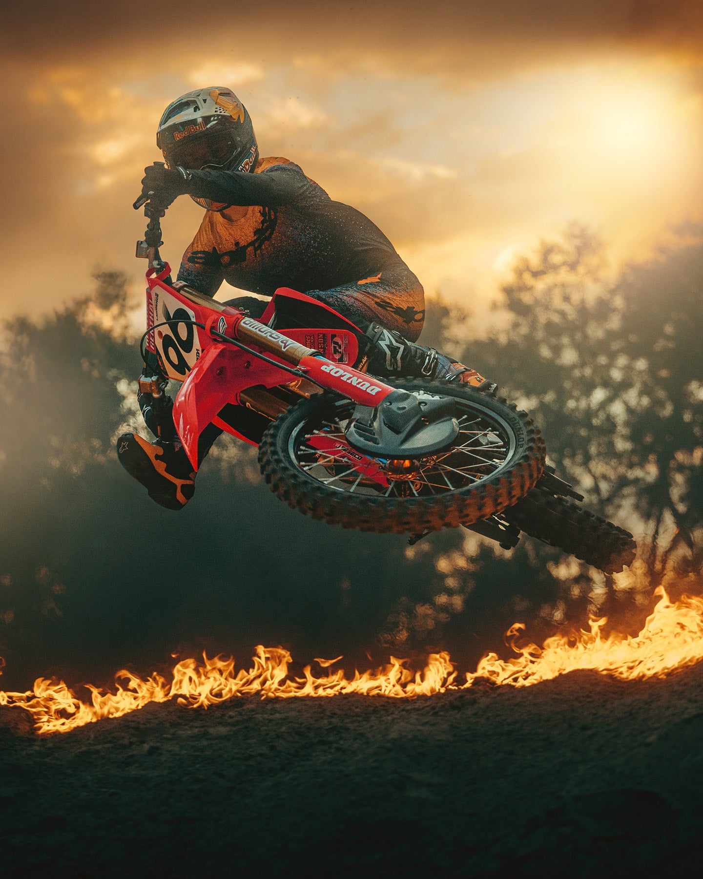 Alpinestars Limited Edition Supertech Black Hole Pants AND Tech 10 Boots, black and orange motocross gear, jumping over fire.