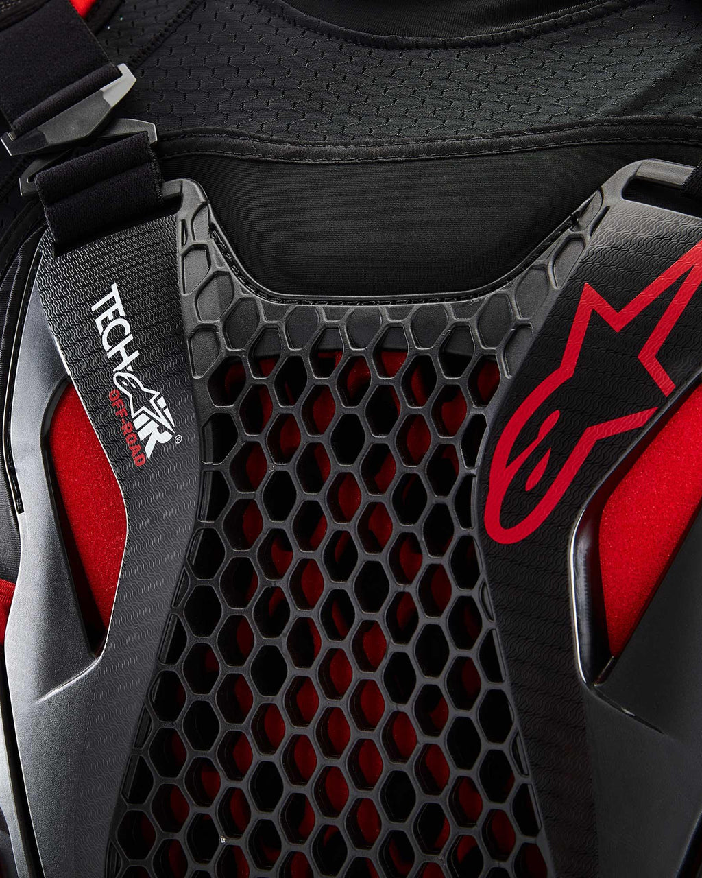 Tech-Air® Off-Road System detail featuring black honeycomb Nucleon CELL protection and red Alpinestars branding.