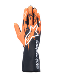 Alpinestars Tech-1 K V3-handskar, kartinghandskar, svarta, orangea och vita, med en sublimerad grafisk design med orangea penseldragsmönster på en svart bas, stor vit Astar-logotyp på ovansidan, vertikal Alpinestars-text på kragen, professionell kartingutrustning
