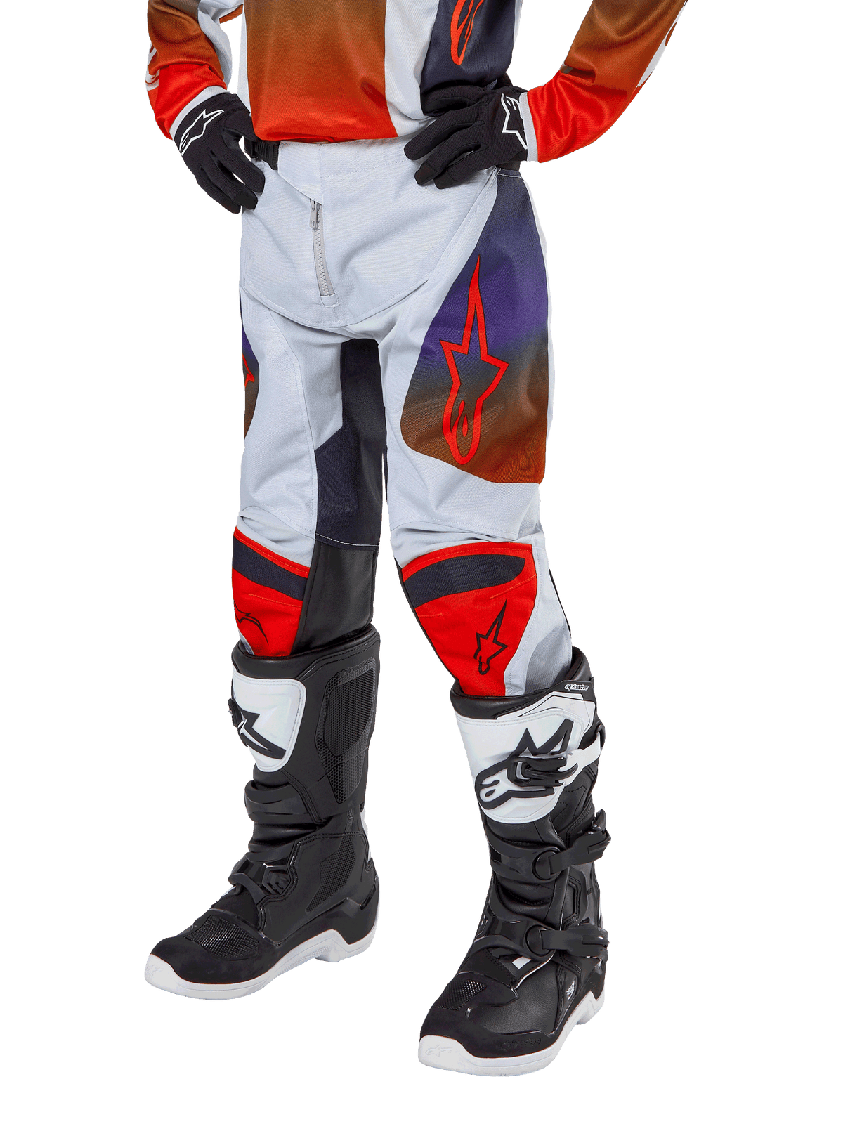 Alpinestars 2024 Youth Racer Hoen Pants, Motocross Pants, Light Gray with Hot Orange and Black accents, featuring red star logos on thighs and red knee panels, worn with black and white boots, durable design for off-road racing