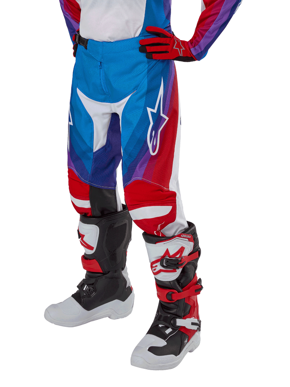 Alpinestars Youth 2024 Racer Pneuma Pants, Motocross Pants, Blue Red and White, worn with matching gloves and boots, featuring a white star logo on the thigh, sporty design for off-road riding