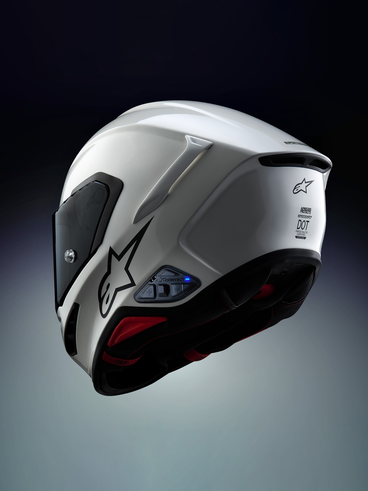 Alpinestars A-Connect kommunikationssystem installerat på en Alpinestars S-R7 motorcykelhjälm, vit och svart, med Mesh 3.0-intercom och Bluetooth 5.3-kontrollenhet med aktiv blå LED-statuslampa